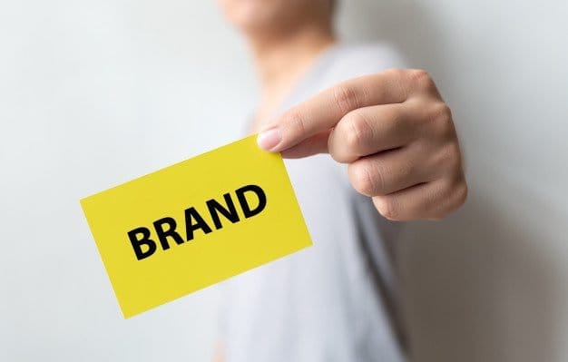 man holding yellow card word brand brand building success concept 20693 241