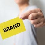 man holding yellow card word brand brand building success concept 20693 241